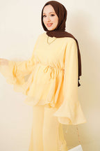https://cdn.pazarium.com.tr/firfirli-sifon-tunik-ikili-takim-sari-803329-19-B.jpg