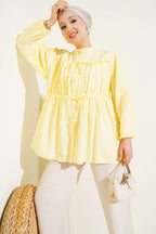 https://cdn.pazarium.com.tr/fiyonklu-buzgulu-gomlek-sari-661256-15-B.jpg