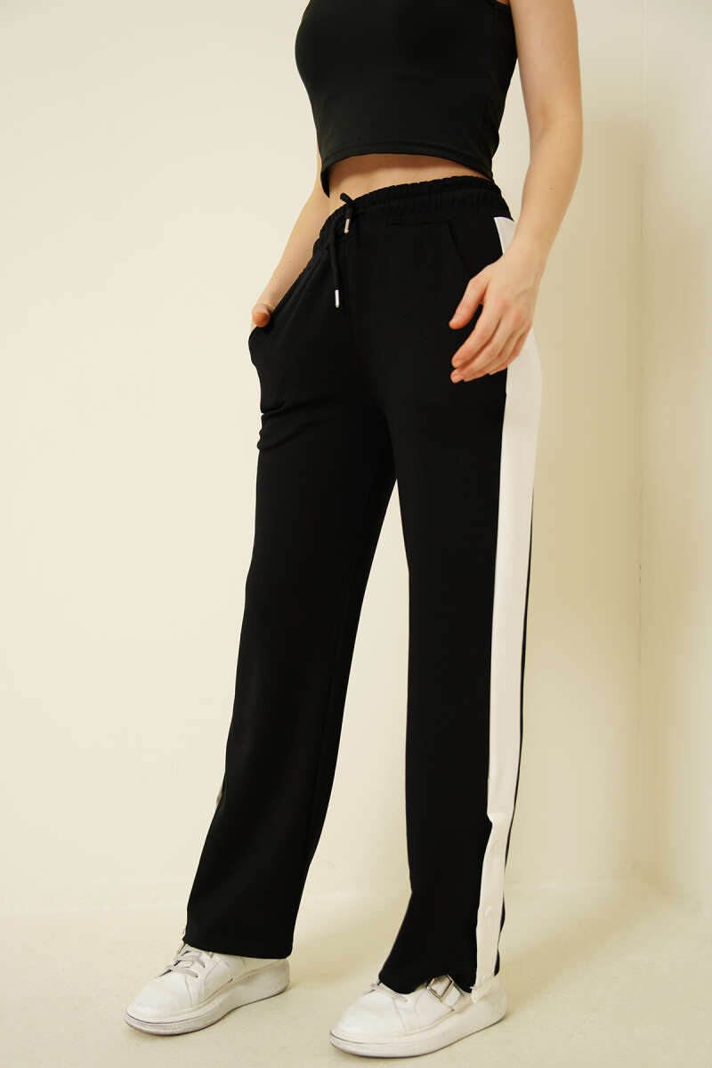 https://cdn.pazarium.com.tr/genis-seritli-citcitli-loysa-pantolon-siyah-742276-18-B.jpg
