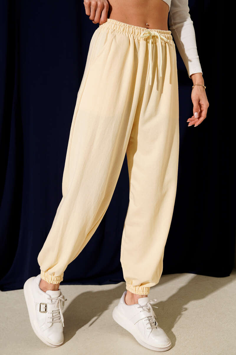 https://cdn.pazarium.com.tr/iki-ip-paca-lastikli-jogger-pantolon-sari-698460-16-B.jpg
