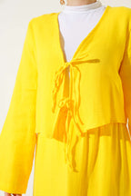 https://cdn.pazarium.com.tr/ip-bagcik-kimono-etekli-ikili-takim-sari-659806-15-B.jpg