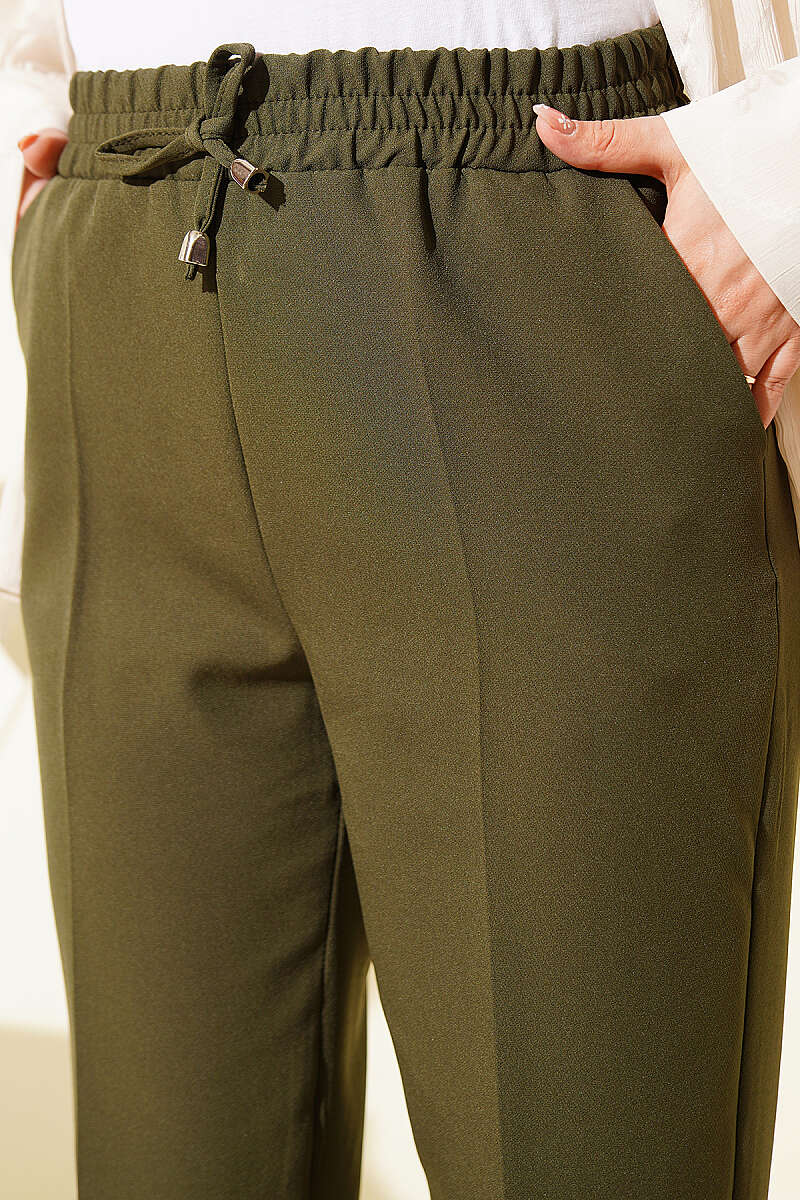 https://cdn.pazarium.com.tr/ip-detayli-beli-lastikli-dar-paca-haki-pantolon-780399-67-B.jpg