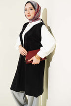 https://cdn.pazarium.com.tr/kabartmali-uzun-triko-yelek-siyah-754927-18-B.jpg