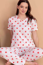 https://cdn.pazarium.com.tr/kalp-desen-kisa-kol-pijama-takimi-ekru-601088-14-B.jpg