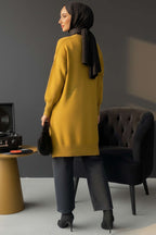 https://cdn.pazarium.com.tr/kare-kabartmali-yumos-triko-tunik-yag-yesili-683282-16-B.jpg