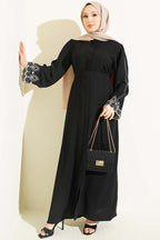 https://cdn.pazarium.com.tr/kol-ucu-nakisli-kusakli-abaya-siyah-812753-20-B.jpg