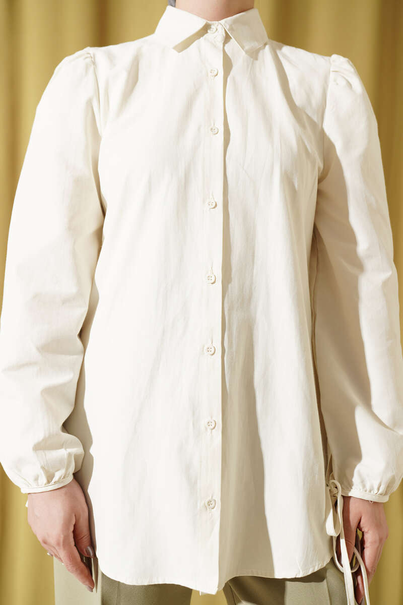 https://cdn.pazarium.com.tr/kollari-bagcik-detayli-gomlek-ekru-756651-18-B.jpg