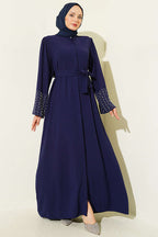 https://cdn.pazarium.com.tr/kollari-inci-suslemeli-abaya-lacivert-799157-19-B.jpg