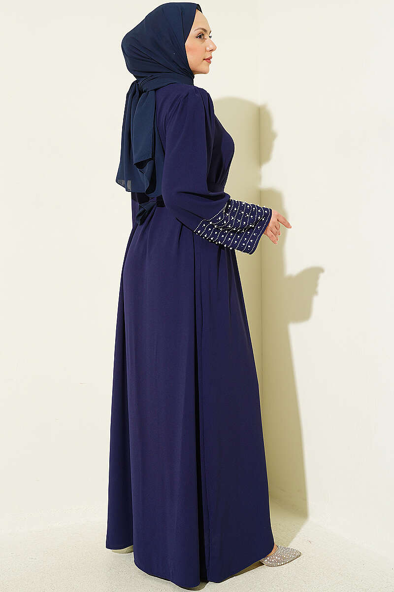 https://cdn.pazarium.com.tr/kollari-inci-suslemeli-abaya-lacivert-799162-19-B.jpg