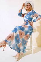 https://cdn.pazarium.com.tr/kruvaze-yaka-desenli-sifon-elbise-indigo-499138-11-B.jpg