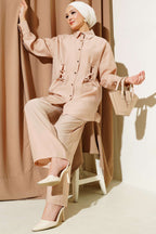 https://cdn.pazarium.com.tr/kus-gozu-detayli-tunik-ikili-takim-camel-596056-14-B.jpg