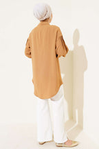 https://cdn.pazarium.com.tr/manset-buzgulu-tunik-camel-637149-11-B.jpg