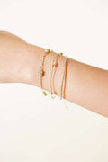 https://cdn.pazarium.com.tr/mini-kalpli-tas-detayli-bileklik-gold-824444-20-B.jpg