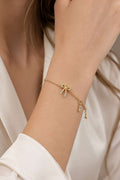 https://cdn.pazarium.com.tr/mini-kurdele-fiyonklu-bileklik-gold-811167-20-B.jpg