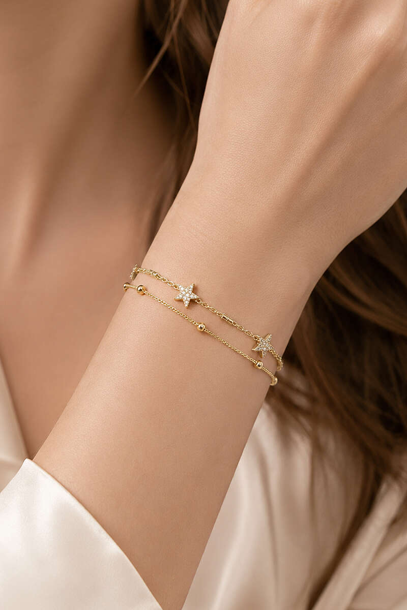 https://cdn.pazarium.com.tr/mini-yildiz-figurlu-bileklik-gold-811097-20-B.jpg