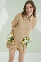 https://cdn.pazarium.com.tr/nbb-cep-nakisli-sortlu-muslin-pijama-takimi-bej-614642-14-B.jpg