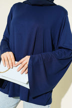 https://cdn.pazarium.com.tr/omuz-vatkali-genis-kollu-tunik-lacivert-793861-19-B.jpg