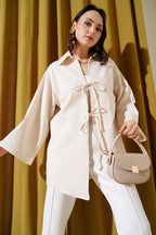 https://cdn.pazarium.com.tr/onu-bagcikli-keten-kimono-bej-618593-14-B.jpg