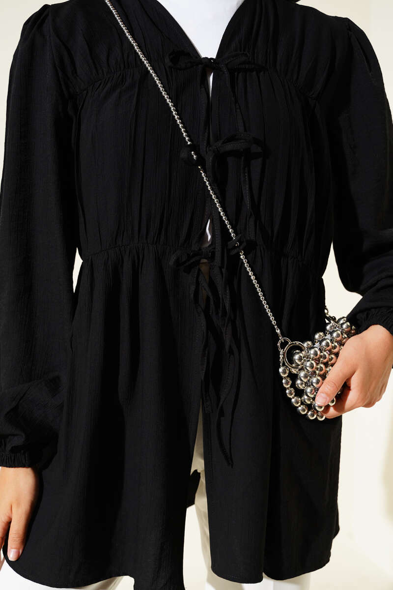 https://cdn.pazarium.com.tr/onu-buzgulu-bilekleri-lastikli-kimono-siyah-643301-15-B.jpg