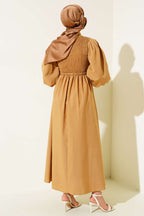 https://cdn.pazarium.com.tr/onu-gipeli-elbise-camel-530619-11-B.jpg