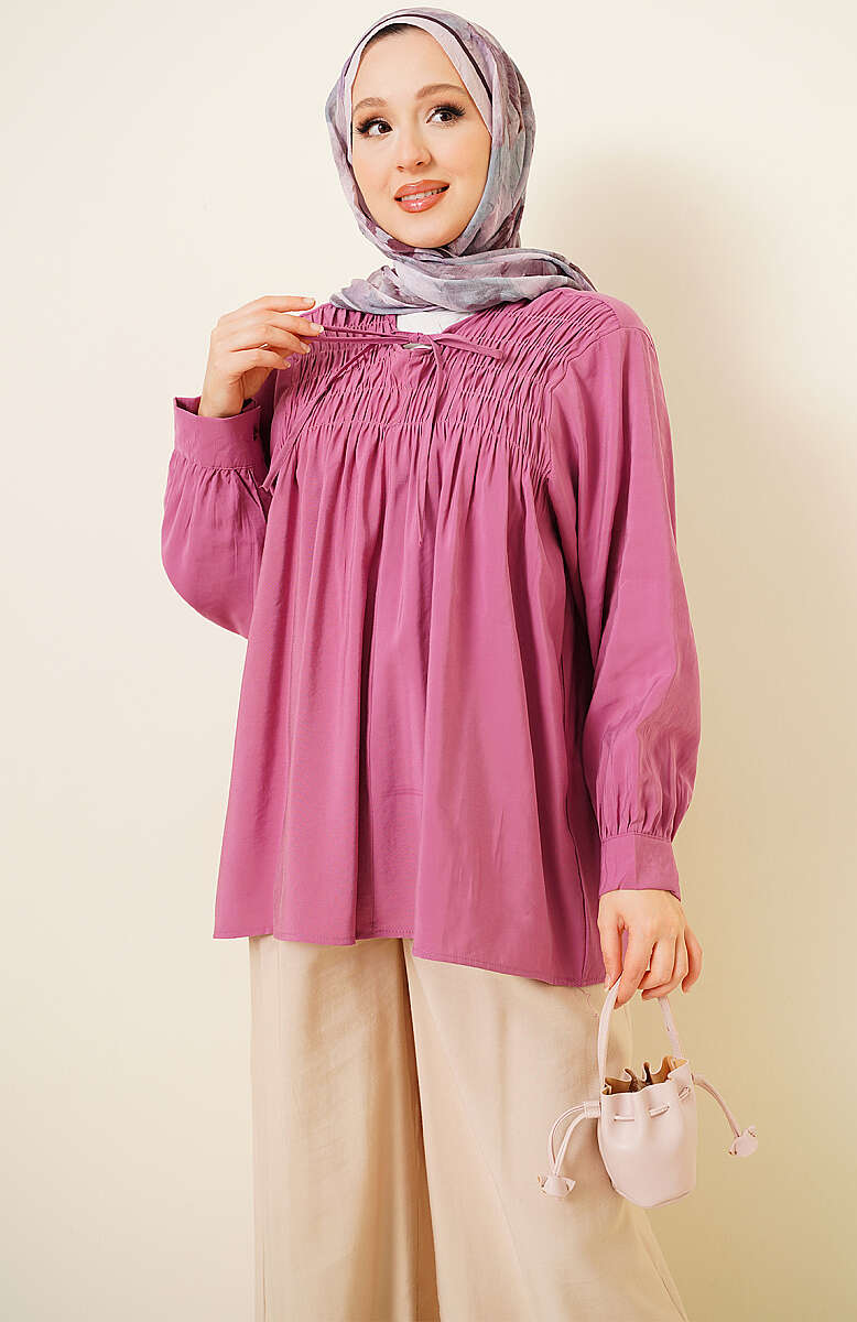 https://cdn.pazarium.com.tr/onu-gipeli-modal-tunik-magenta-803204-19-B.jpg