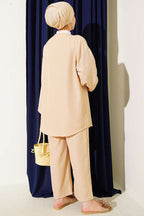 https://cdn.pazarium.com.tr/onu-ip-bagcikli-kimono-ikili-takim-bej-810648-20-B.jpg
