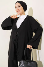 https://cdn.pazarium.com.tr/onu-ip-bagcikli-kimono-ikili-takim-siyah-810718-20-B.jpg