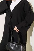 https://cdn.pazarium.com.tr/onu-ip-bagcikli-kimono-ikili-takim-siyah-810720-20-B.jpg
