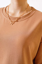 https://cdn.pazarium.com.tr/oversize-basic-t-shirt-latte-497608-11-B.jpg