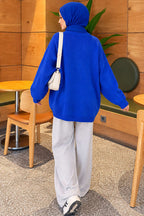 https://cdn.pazarium.com.tr/oversize-dusuk-omuz-triko-tunik-saks-838848-20-B.jpg