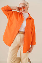 https://cdn.pazarium.com.tr/oversize-gomlek-oranj-787055-19-B.jpg