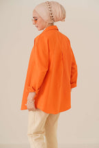 https://cdn.pazarium.com.tr/oversize-gomlek-oranj-787057-19-B.jpg