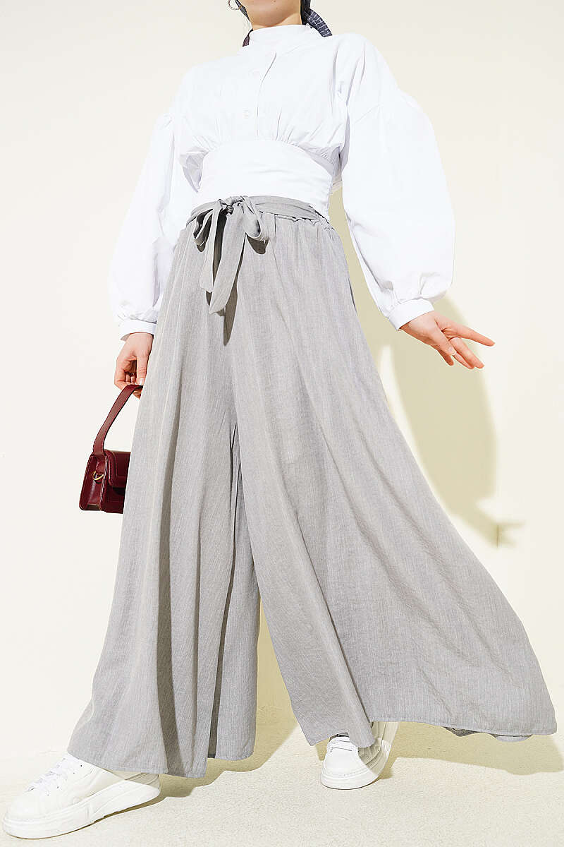 https://cdn.pazarium.com.tr/oversize-pacali-baglamali-pantolon-gri-762655-18-B.jpg