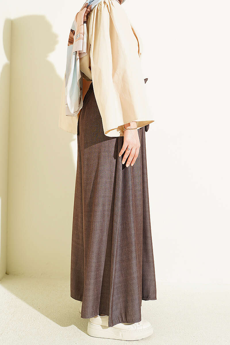 https://cdn.pazarium.com.tr/oversize-pacali-baglamali-pantolon-kahve-762653-18-B.jpg