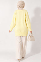 https://cdn.pazarium.com.tr/oversize-ribanali-triko-tunik-sari-822602-20-B.jpg