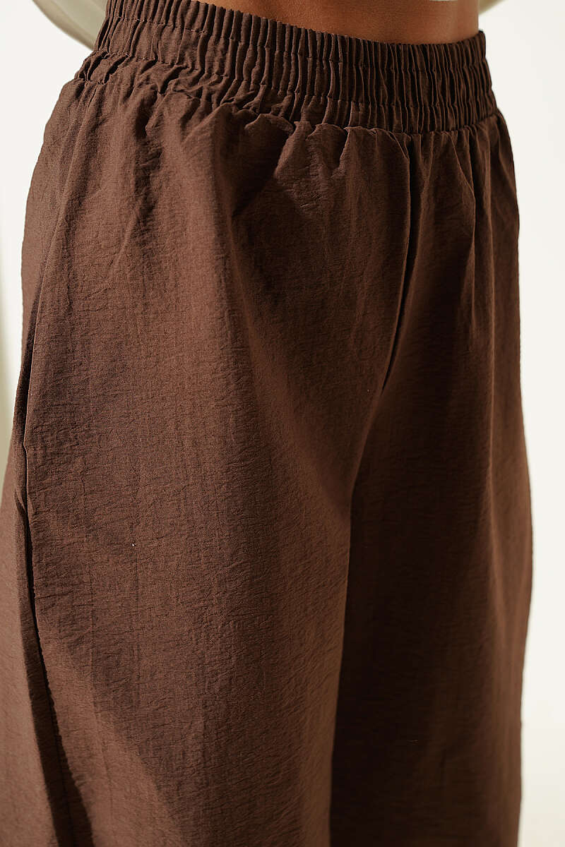 https://cdn.pazarium.com.tr/paca-lastikli-parasut-jogger-pantolon-kahve-761553-18-B.jpg