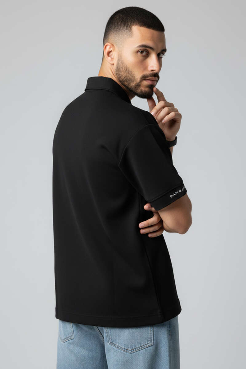 https://cdn.pazarium.com.tr/polo-yaka-kol-yazili-oversize-erkek-t-shirt-siyah-750021-18-B.jpg