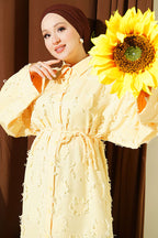 https://cdn.pazarium.com.tr/puskul-detayli-ip-bagcikli-uzun-tunik-sari-813060-20-B.jpg