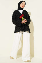 https://cdn.pazarium.com.tr/puskullu-firfirli-ip-baglamali-kimono-siyah-789008-19-B.jpg