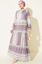 https://cdn.pazarium.com.tr/retro-cicek-desenli-sifon-elbise-lila-815593-20-B.jpg