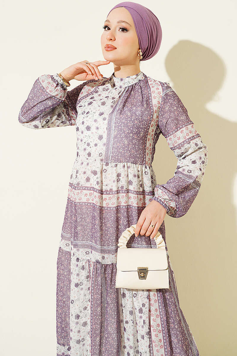 https://cdn.pazarium.com.tr/retro-cicek-desenli-sifon-elbise-lila-815594-20-B.jpg