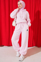 https://cdn.pazarium.com.tr/s-armali-sardonlu-jogger-pantolon-pembe-839533-20-B.jpg