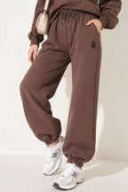 https://cdn.pazarium.com.tr/s-armali-sardonlu-jogger-pantolon-vizon-839526-20-B.jpg