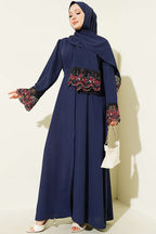 https://cdn.pazarium.com.tr/salli-cicek-suslemeli-abaya-elbise-lacivert-799140-19-B.jpg