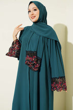 https://cdn.pazarium.com.tr/salli-cicek-suslemeli-abaya-elbise-zumrut-799151-19-B.jpg