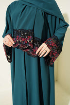 https://cdn.pazarium.com.tr/salli-cicek-suslemeli-abaya-elbise-zumrut-799154-19-B.jpg