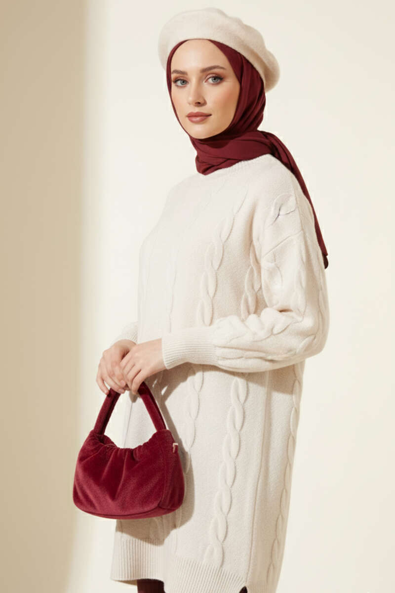 https://cdn.pazarium.com.tr/sarmal-kabartmali-yumos-triko-tunik-tas-693463-16-B.jpg