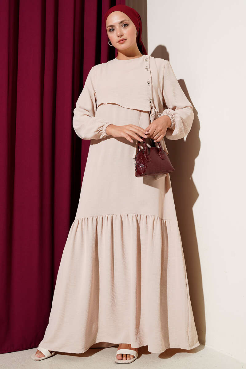 https://cdn.pazarium.com.tr/tasli-kus-gozu-detayli-baglamali-elbise-bej-656167-15-B.jpg