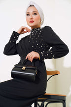 https://cdn.pazarium.com.tr/tegoe-2025-omuz-tasli-elbise-siyah-s-521896-12-B.jpg