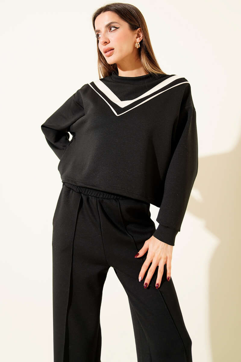 https://cdn.pazarium.com.tr/v-yaka-seritli-sweatshirt-ikili-takim-siyah-712286-17-B.jpg